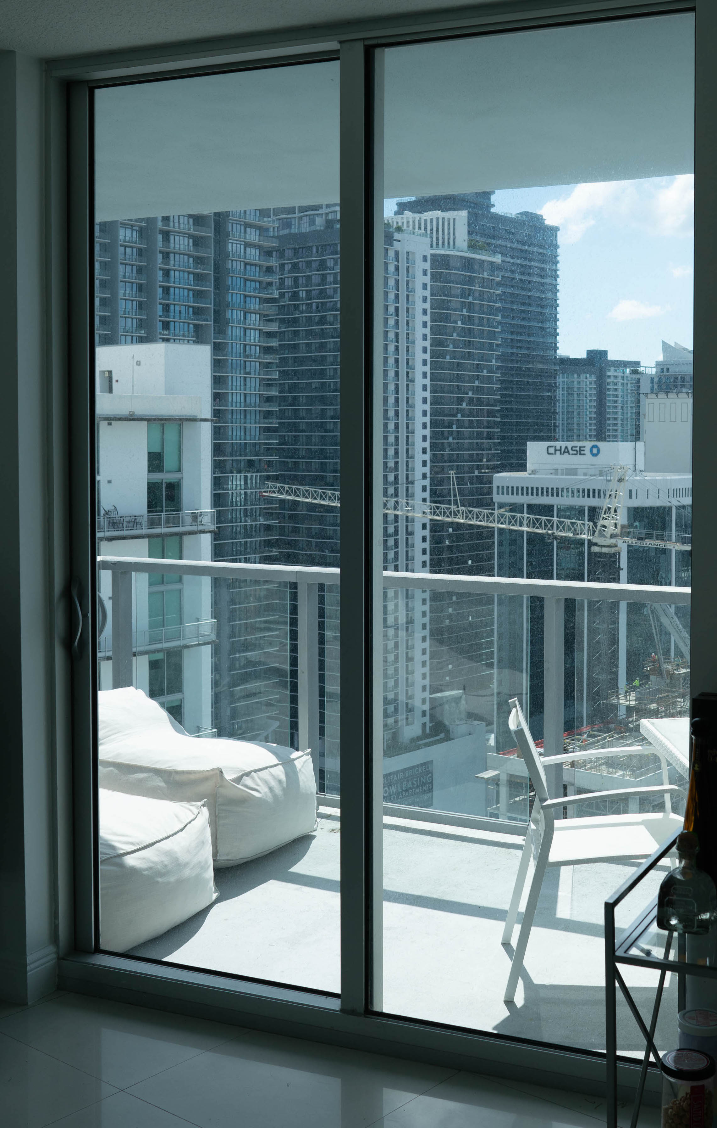 Brickell condo balcony before turf installation — bare concrete slab