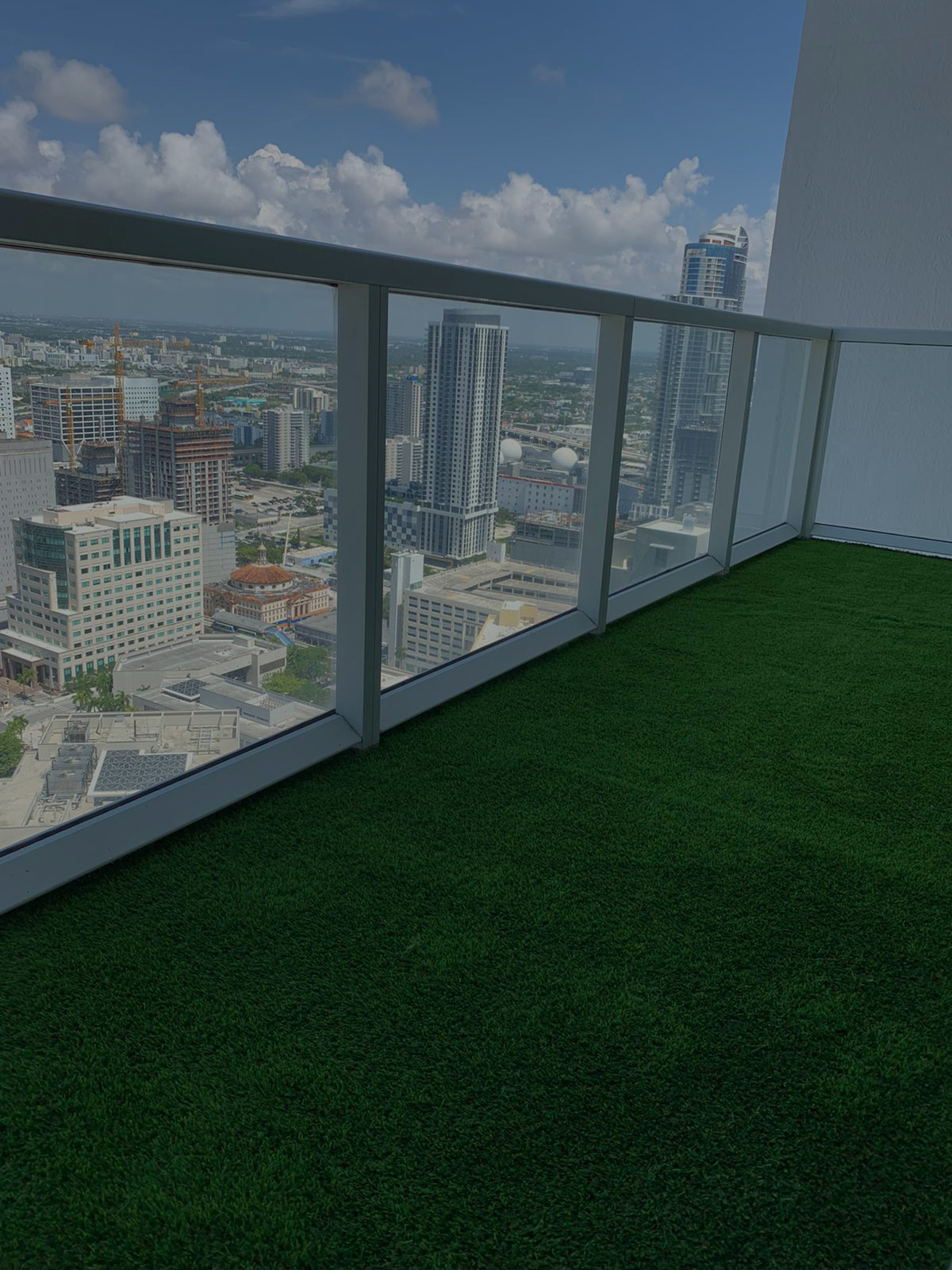 Green artificial turf balcony in Miami Beach with ocean view