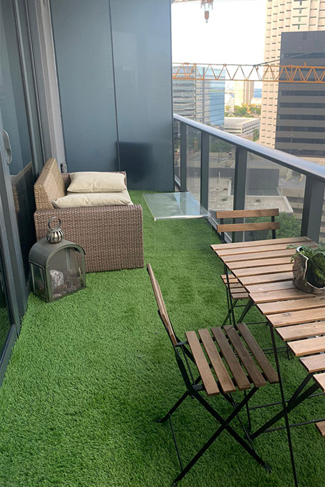 Miami Beach lifestyle — balcony with green turf overlooking the ocean